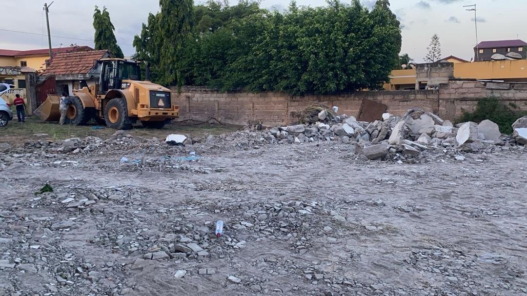 Loader removing rubble